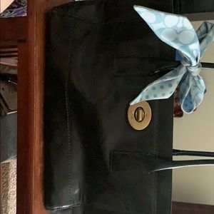 Medium black leather coach purse with blue bow